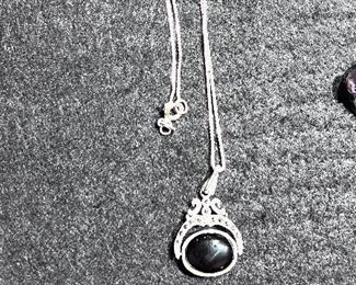 Sterling Silver - this necklace flips from a white stone to a black stone - SOME OF THE JEWELRY MAY BE SOLD