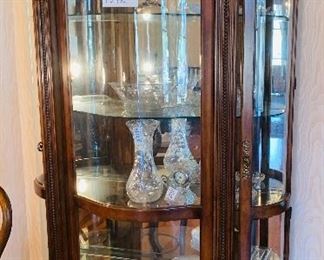 lighted curved glass curio cabinet