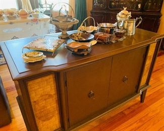 old cabinet and many early serving  pieces