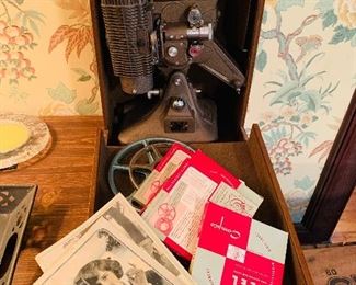 Early film projector with extra reels and brochures 