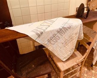 19th century ironing board that went over two wooden straight chairs