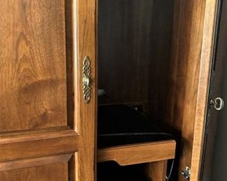 Doors push backwards inside the cabinet