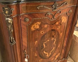 A gorgeous cabinet with a marble top