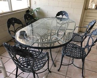 Wrought iron glass top table and chairs