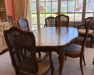 French Provincial dining table shown with 4 of the six chairs
