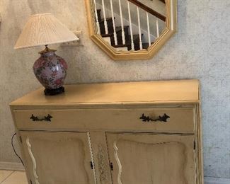 Buffet with key shown with coordinating mirror