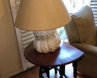 One of several drop leaf gate leg tables - shown with lamp with a white ceramic grape cluster base