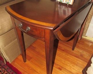 There are a pair of these top quality inlaid drop-leaf tables.