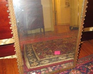 Antique beveled mirror with Gothic metal frame