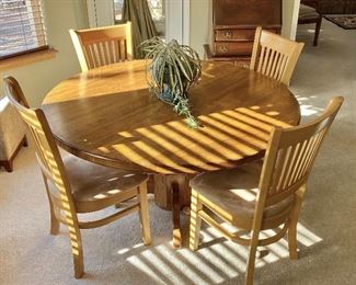 Nice Oak Dining/Kitchen table. Showing unmatched chairs.