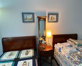A Closer look at the Antique Matching Twin Beds, Antique Side Table, Tall, arched accent mirror, Original Art, Wooden Bird Décor