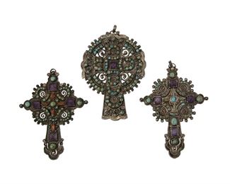 4
Three Matl Silver And Stone Cross Pendants, By Matilde Poulat
Two groupings:

A silver, turquoise, and amethyst cross pendant with circular nimbus or Celtic cross motif
Second Half 20th Century; Mexico City, Mexico
Etched: Patente 10593 / Mexico / 925 / Matl
3.75" H x 2.5" W

Two similar silver, turquoise, amethyst, and coral cross pendants with hinged lower points
Second Half 20th Century; Mexico City, Mexico
One etched: Patente 10464 / Mexico / 925 / Matl / MREG 14207; One stamped: Matl / Mexico 925 / SALAS
Larger: 4" H x 2.625" W; Smaller: 3.5" H x 2.625" W

3 pieces
81.3 grams gross
Estimate: $800 - $1,200