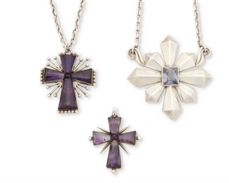 6
A Group Of Antonio Pineda Silver And Stone Maltese Cross Pendants
1953 or later; Taxco, Mexico
Each stamped with crown mark for Antonio Pineda / [Eagle 17]; Each variously stamped: Hecho en Mexico / Silver / 970 / Mexico; Small cross: YY470
A group of stylized Maltese cross pendants comprising a mixed-cut blue stone cross suspended by attached chains (20.25" L x 2.75" H), an amethyst set cross suspended on a detachable chain (20" L x 2.125" H), and an amethyst cross ( 2" H x 1.625" W)

4 pieces
117.5 grams gross
Estimate: $1,500 - $2,500