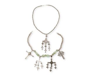 8
Two Mexican Silver Cross Necklaces
Two works:

A necklace with four silver crosses of various ages and designs attached to a silver bead and green glass necklace
Second Half 20th Century
Crosses stamped variously: Sterling; ERE / 925 / [Eagle 3]; JCB / Taxco / Mexico / 925 / Eagle 3; JA / [candelabra] / Ster / ©
19.5" L x 4.25" H

A necklace of a single strand of silver beads supporting an angel cross, finished with dangling balls and crosses
Second Half 20th Century
Appears unmarked
27" L x 5.25" H

2 pieces
239.3 grams gross
Estimate: $500 - $700