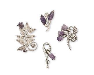 26
A Group Of Fred Davis Silver And Amethyst Brooches
Pre-1948; Mexico City, Mexico
Each stamped with FD for Fred Davis; Further stamped: Silver / Mexico / Made in Mexico
Consisting of four silver brooches with carved amethyst flowers and leaves, comprising a large sprig of leaves with single bloom and tiny bud (3" H x 4" W), a sprig with three blooms (2.75" H x 3.25" W), a wirework sprig with amethyst leaves (2.5" H x 2.25" W), and a small wirework sprig with single bloom (1.75" H x 3.25" W)

4 pieces
132.6 grams gross
Estimate: $1,000 - $1,500