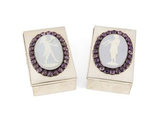 29
Two Fred Davis Sterling Silver And Gem-Set Vanity Boxes
Second-Quarter 20th Century; Mexico City, Mexico
Each stamped for Fred Davis; Further stamped 925 or sterling
Each rectangular silver box centering a Wedgwood-style porcelain plaque, one with a pan figure and one with a woman playing cymbols, each enclosed in an amethyst and purple stone frame, 2 pieces
Each: 1.875" H x 3.5" W x 2.375" D
9.07 gross oz. troy approximately
Estimate: $200 - $300