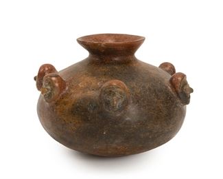 34
A Pre-Columbian Colima Pottery Jar
Circa 200 BCE-100 CE
Designed with applied faces to the body
7.5" H x 10.5" W x 10.5" D
Estimate: $1,000 - $1,500