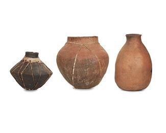 37
Three Mexican Pottery Jars
Three works:

A rawhide-bound pottery jar
Mid-20th Century or Earlier; Tarahumara people, Chihuahua, Mexico
With narrow neck and flared waist
11" H x 12" Dia.

A rawhide-bound pottery jar
Mid-20th Century or Earlier; Tarahumara people, Chihuahua, Mexico
With wide shoulder
14.5" H x 15" Dia.

A micaceous jar with fire clouding
Mid-20th Century or Earlier; Pai Pai people; Baja, Mexico
16" H x 10" Dia.

3 pieces
Estimate: $200 - $300