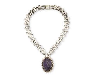 38
A Héctor Aguilar Silver And Amethyst Pendant Necklace
1948 or later; Taxco, Mexico
Each stamped with conjoined HA for Héctor Aguilar; Further stamped: 940 / Taxco / [Eagle 9]
Comprised of an elaborate, incised paper-clip style chain suspending a large amethyst cabochon with silver ball surround.

2 pieces
Necklace: 17" L; Pendant: 2.125" H x 1.375" W
142.7 grams gross
Estimate: $800 - $1,200