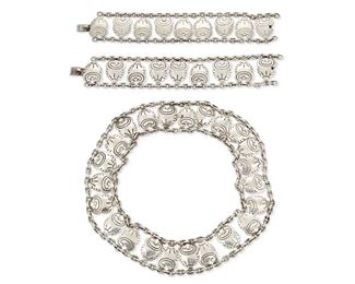42
A Group Of Héctor Aguilar Silver Jewelry
1948-1962 and 1953-1962; Taxco, Mexico
Each stamped: HA [conjoined] / [940 or .940] / Taxco / [Eagle 9]
Each piece designed with stylized blossom links joined by link chains, comprising a necklace and a pair of bracelets

3 pieces
Necklace: 17" L x 1.25" H; Bracelets: 7" L x 1.25" H
271.3 grams gross
Estimate: $600 - $800