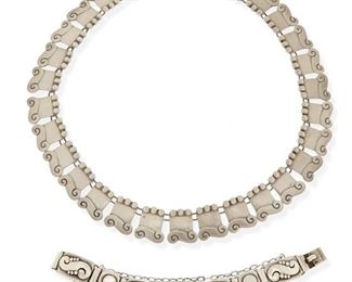 44
A Set Of Héctor Aguilar Jewelry
1940-1945 and 1948-1962; Taxco, Mexico
Stamped for Héctor Aguilar; Further stamped: Taxco / Mexico / 940 / [Eagle 9]
Comprising a triple-ball and S-link necklace and a complimentary bracelet with similar S-link and ball links alternating with dot spacers

2 pieces
Necklace: 16.5" L x 0.75" H; Bracelet: 6.5" L x 0.5" H
123.2 grams gross
Estimate: $500 - $700