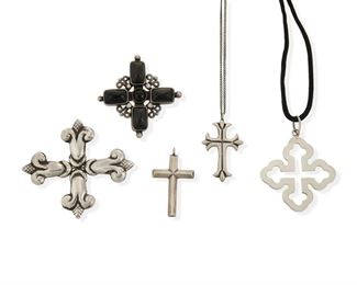 46
A Group Of Héctor Aguilar Silver Crosses
Five works:

An incised cross brooch
Post-1940; Taxco, Mexico
Stamped: HA [conjoined] / Taxco / 940
2.5" H x 2.75" W

A cross pendant with five black onyx and obsidian cabochons
Post-1940; Taxco, Mexico
Stamped: HA [conjoined] / Made in Mexico / Sterling
2.125" H x 2.5" W

An openwork quatrefoil cross pendant on a satin cord
Post-1940; Taxco, Mexico
Stamped: HA [conjoined] / Sterling / Taxco / Mexico
2.25" H x 1.875" W

A small cross pendant
Post-1940; Taxco, Mexico
Stamped: HA [conjoined] / Taller Borda / Taxco / Mexico / .940 / [Eagle 9]
1.75" H x 1" W

A small decorative cross pendant
Post-1940; Taxco, Mexico
Stamped: Taxco; inscribed: Glenna 10-7-58
1.75" H x 1" W; Chain: 15.5" L

5 pieces
72.2 grams gross
Estimate: $200 - $300