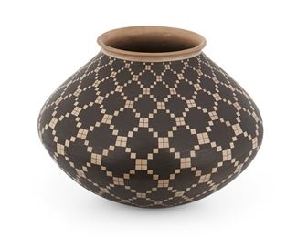 47
A Mata Ortiz Pottery Jar, By Juan Quezada
(b. 1940, Mata Ortiz, Mexico)
Signed to the inside of the neck: Juan Quezada
The duotone, earthenware jar with a crisscrossing "elastic" design
6.75" H x 9.5" Dia.
Estimate: $2,000 - $3,000