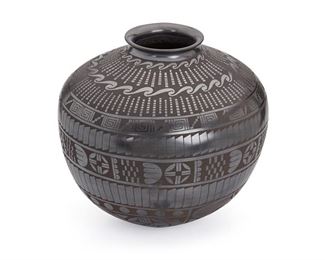 49
A Large Mata Ortiz Blackware Pottery Olla, By Jesus Peña
Fourth-Quarter 20th Century; Mata Ortiz, Mexico
Signed: Jesus Peña
The black-on-black vessel with all-over geometric motifs
13.5" H x 15.5" Dia.
Estimate: $300 - $500