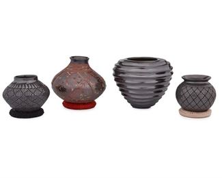50
Four Mata Ortiz Pottery Vessels
Four works:

A Naty D. Ortiz and Cesar Nuñez blackware pottery vase
Fourth-Quarter 20th Century; Mata Ortiz, Mexico
Signed: Naty D. Ortiz / Cesar D. Nuñez
With tapered spiral design
5" H x 6.5" W

A Naty D. Ortiz and Cesar Nuñez polychrome pottery vase
Fourth-Quarter 20th Century; Mata Ortiz, Mexico
Signed: Naty D. Ortiz / Cesar D. Nuñez
With polychrome geometric and figural motifs on blackware
4.75" H x 6" Dia.

A Susy D. Martinez blackware pottery vase
Fourth-Quarter 20th Century; Mata Ortiz, Mexico
Signed: Susy D. Martinez
The black on black vase with geometric lattice pattern
3.75" H x 4" Dia.

A blackware pottery vase
Fourth-Quarter 20th Century; Mata Ortiz, Mexico
Signed: Fernando G.
The black on black vase with geometric lattice pattern
4" H x 4.5" Dia.

4 pieces
Estimate: $400 - $600