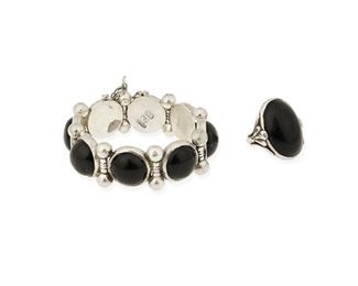 54
Two Héctor Aguilar Silver And Onyx Jewelry Items
1940-1945 and 1953-1962; Taxco, Mexico
Each stamped: HA [conjoined] / Taxco / 940; Ring: [Eagle 9]; Bracelet: 990
A link bracelet set with round onyx cabochons with silver barbell spacers and a ring set with an oval onyx cabochon

2 pieces
Bracelet: 7" L x 0.875" H; Ring size: 8
100.6 grams gross
Estimate: $600 - $800