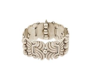 56
A Héctor Aguilar Silver Link Bracelet
1948-1962; Taxco, Mexico
Stamped: HA [conjoined] / Taxco / Mexico / .940 / [Eagle 9]
A foliate and ball-motif linked bracelet with pin closure and chain guard
7" L x 1.25" H
102.1 grams
Estimate: $500 - $700