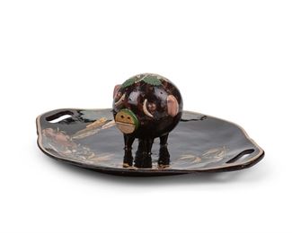 61
A Tlaquepaque Hors D'oeuvres Platter, By Josefina Arias
Circa 1920s; Tlaquepaque, Mexico
Marked: Arias / Made in Mexico
The glazed, polychrome pottery platter with figural pig to the center, pierced to hold toothpicks, decorated with campesino and floral motifs
6" H x 17.25" W x 14.5" D
Estimate: $400 - $600
