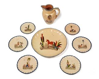 65
A Group Of Tlaquepaque Pottery Serving Items
Circa 1930s; Tlaquepaque, Mexico
Pitcher marked: Made in Mexico; Each plate marked: Mexico
Each glazed cream pottery with polychrome campesino and animal motifs, comprising a charger (2" H x 14" Dia.), four Baxter salad plates (each: 7.75" Dia.), and two Delicate Dan dessert plates (each: 6.5" Dia.), each with fluted blue rims, and a Donkey Blues pitcher (9" H x 8" W x 6.25" D), 8 pieces
Estimate: $200 - $400