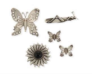 73
A Group Of Silver Brooches By Héctor Aguilar
1940-1945 and 1955-1962; Taxco, Mexico
Each stamped for Héctor Aguilar; Further stamped: 940 / Taxco; Grasshopper stamped: [Eagle 9]
Comprising a large butterfly brooch (2.5" H), two small butterfly brooches (each: 1" H), an onyx set floral brooch (2" Dia.), and a grasshopper brooch (0.75" H x 3" W)

5 pieces
61.5 grams gross
Estimate: $300 - $500
