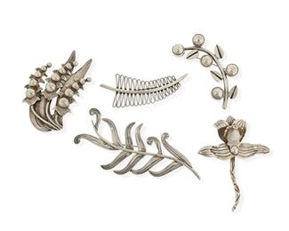74
A Group Of Héctor Aguilar Silver Floral Brooches
1940-1945; 1943-1948; 1948-1962; Taxco, Mexico
Each stamped: HA [conjoined]; Further variously stamped: Made in Mexico / Sterling / Taxco / Mexico / .940 / [Eagle 9]
A group of floral and foliate silver brooches, comprising a large fern leaf (2" H x 5.25" W), a floral spray (2.5" H x 3.75" W), an orchid flower (3.75" H x 2.75" W), a bud and leaf sprig (2" H x 3.5" W), and an abstract wirework leaf (1.5" H x 3.625" W)

5 pieces
135.5 grams gross
Estimate: $300 - $500
