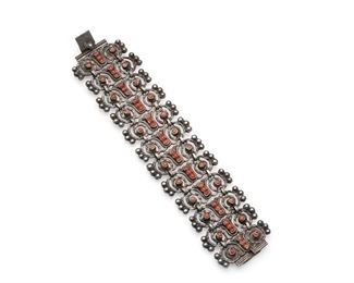 90
A Matl Coral And Sterling Silver Bracelet
1934-1948; Mexico City, Mexico
Signed: Matl / 925 / Hecho en Mexico
Designed by Matilde Poulat, the bracelet features scrolled links set with coral beads, with a clasp closure
7" L x 1.5" H
68 grams
Estimate: $600 - $900