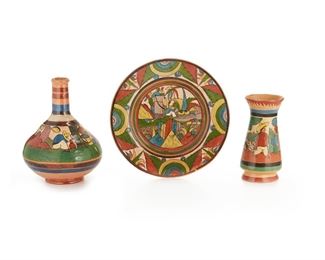 99
Three Tlaquepaque Campesino Pottery Items
Circa 1920s-1940s; Tlaquepaque, Mexico
One marked: Made in Mexico; One inscribed: Mexico
Each with polychrome glazed campesino motifs and petatillo crosshatching, comprising a water bottle (11" H x 8.6" Dia.), a vase (8.5" H x 4.5" Dia.), and a "Yellow Brick Road" charger (12.25" Dia.), 3 pieces
Estimate: $200 - $300