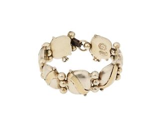 108
A William Spratling Sterling Vermeil Bracelet
1940-1946, First Design Period; Taxco, Mexico
Stamped for William Spratling; Further stamped: Made in Mexico / Spratling Silver
A gold wash silver bracelet with alternating geometric links and silver balls with clasp closure and chain guard
7.5" L x 1" H
68.6 grams
Estimate: $300 - $500