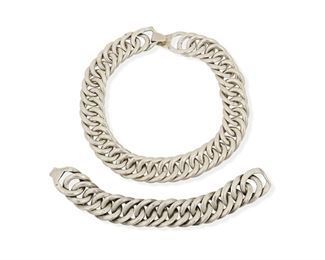 114
A Set Of William Spratling Silver Jewelry
1940-1946, First Design Period; Taxco, Mexico
Each stamped for William Spratling; Further stamped: Made in Mexico
Comprised of a heavy chain link chunky necklace and matching bracelet, each with hook closure

2 pieces
Necklace: 15" L x 1" H; Bracelet: 7.5" L x 1" H
348.5 grams gross
Estimate: $1,000 - $2,000