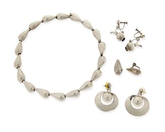 119
A Group Of William Spratling Silver Jewelry
1940-1946, First Design Period; Taxco, Mexico
Each stamped for William Spratling; Others variously stamped for: Sterling / Silver / Made in Mexico
Four works comprising a domed teardrop link necklace (16.5" L x 0.5" H) with matching screw-back ear clips (1" H) and two additional pairs of silver earrings, one of silver pitchers (1.5" L), and one of crescent discs and silver balls (1.75" L)

7 pieces
109.2 grams gross
Estimate: $500 - $700