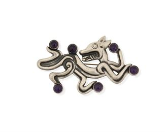 120
A William Spratling Silver And Amethyst Brooch
1940-1946, First Design Period; Taxco, Mexico
Stamped for William Spratling; Further stamped: Made in Mexico / Silver
Designed as a stylized jaguar set with six amethyst cabochons
2.75" H x 4.5" W
49.5 grams
Estimate: $800 - $1,200