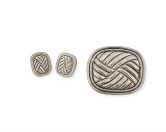 123
A Group Of William Spratling Silver Jewelry
1940-1944 and 1964-1967, First Design Period and Third Design Period; Taxco, Mexico
Each stamped for William Spratling; Brooch: Taxco / Mexico / 925; Earrings: Made in Mexico / Silver / TS-94
Comprising a brooch and a pair of post earrings, all with basket weave motif

3 pieces
Brooch: 2.5" H x 3" W; Each earring: 1.25" L x 1" W
59.6 grams gross
Estimate: $300 - $500