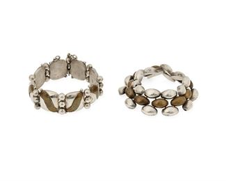 125
A Pair Of William Spratling Silver And Copper Bracelets
1940-1946, First Design Period; Taxco, Mexico
Each stamped for William Spratling; Further stamped: Made in Mexico / Silver
Consisting of two link bracelets, each with silver and copper elements, comprising one with abstract overlay lozenge links alternating with silver balls (7.5" L x 0.875" H), and one with multiple interlinked small domed silver and copper elements (7.5" L x 1" H)

2 pieces
130 grams gross
Estimate: $700 - $900