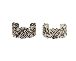 129
A Pair Of William Spratling Silver Cuff Bracelets
1942, First Design Period; Taxco, Mexico
Each stamped: Spratling Silver / Made in Mexico
Each bracelet in chased silver designed with overall intertwined Aztec motifs

2 pieces
Each: 6.5" total inner C x 1.25" H, wrist opening: 1.25"
179.8 grams gross
Estimate: $800 - $1,200