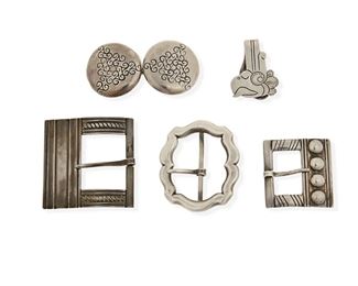 134
A Group Of William Spratling Silver Accessories
1933-1939, First Design Period; Taxco, Mexico
All stamped for William Spratling; Five stamped: Taxco / 980; One stamped: Taxco / 925
Comprising four belt buckles of various designs and one money clip with chased motif

6 pieces
Buckle size range: 2.25" H x 2.25" W to 1.5" H x 3" W; Clip: 1.5" H x 1.25" W
136.5 grams gross
Estimate: $200 - $300