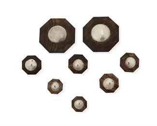 136
A Group Of Spratling-Style Silver And Rosewood Buttons
Mid-20th Century; Mexico
Unmarked, attributed to William Spratling
A group of octagonal rosewood buttons each with central silver disc and small wire shank on reverse

8 pieces
Two: 2.375" H x 2.375" W; Four: 1.125" H x 1.125" W; Two: 0.875" H x 0.875" W
69.1 grams gross
Estimate: $300 - $500