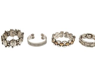 138
A Group Of William Spratling Silver And Copper Jewelry
1940-1946 and 1950-1967, First and Third Design Period; Taxco, Mexico
Each stamped for William Spratling; Further stamped: Made in Mexico / Sterling / Silver; One stamped: Eagle 63
A group of silver bracelets, comprising a dog bone-shaped cuff (6.625" total inner C x 1" H), a chased silver abstract link bracelet with silver ball accents (8.5" L x 1.125" H), a bracelet with rectangular tile-shaped links (6.25" L x 0.75" H) and a bracelet with interlinked domed silver and copper elements (8.5"L x 0.875" H)

4 pieces
249.5 grams gross
Estimate: $1,000 - $1,500