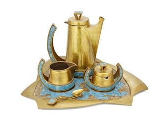 147
A Salvador Terán Mosaic And Brass Coffee Service
Third-Quarter 20th Century
Each marked: Handwrought / Salvador / 408; Three further marked: Hecho en Mexico; Tray further marked: Mexico
The coffee service with light blue and brown glass mosaic on brass, comprising a fitted tray (16.75" W x 13.75" D), a coffee pot (8.875" H x 7.5" W x 4.25" D), a creamer (4.25" H x 5" W x 3.5" D), and a sugar bowl with lid and spoon (3.325" H x 5" W x 4.25" D), 5 pieces
Estimate: $400 - $600