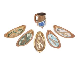 148
A Group Of Salvador Terán Mosaic And Brass Table Items
Third-Quarter 20th Century
Each marked: Handwrought / Salvador; Further variously marked: Hecho en Mexico / Mexico
Each with polychrome glass mosaic on brass depicting various figural and geometric motifs, comprising a pitcher and five oval trays, 6 pieces
Pitcher: 8.375" H x 6.75" W x 5.25" D; Each tray: 1.5" H x 1.75" W x 5.875" D approximately
Estimate: $300 - $500