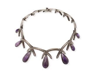 151
An Antonio Pineda Silver And Amethyst Necklace
1953-1979; Taxco, Mexico
Stamped: Taxco / Mexico / CM / 970 / [Eagle 121]
Designed as curve X-form links suspending pear shaped amethyst drops
16.25" L x 1.75" H
147.1 gram
Estimate: $800 - $1,200